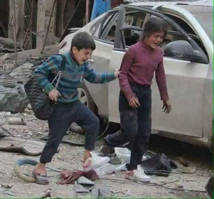 طفل-وطفلة-بعد-قصف-مدينة-حلب-سوريا